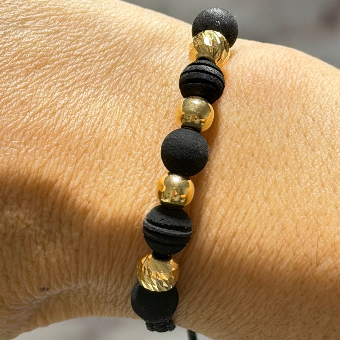 Bracelet with gold beads