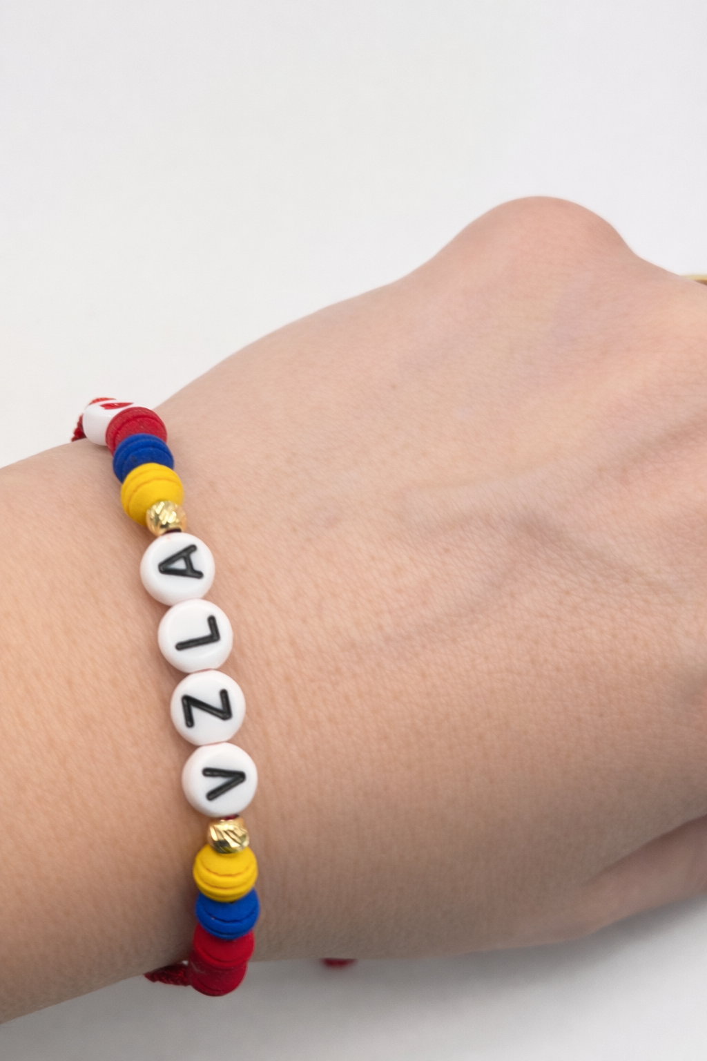 BRACELET WITH GOLD BEADS