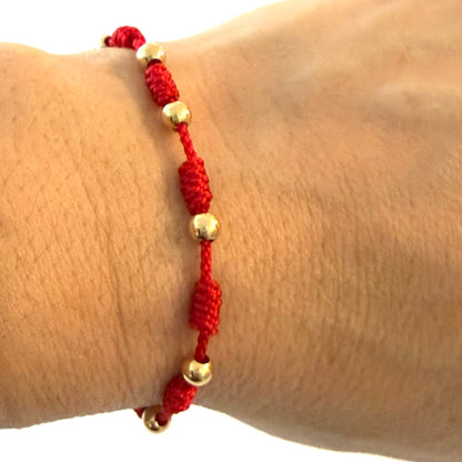 7/PULSERA NUDO CON CUENTAS DE ORO