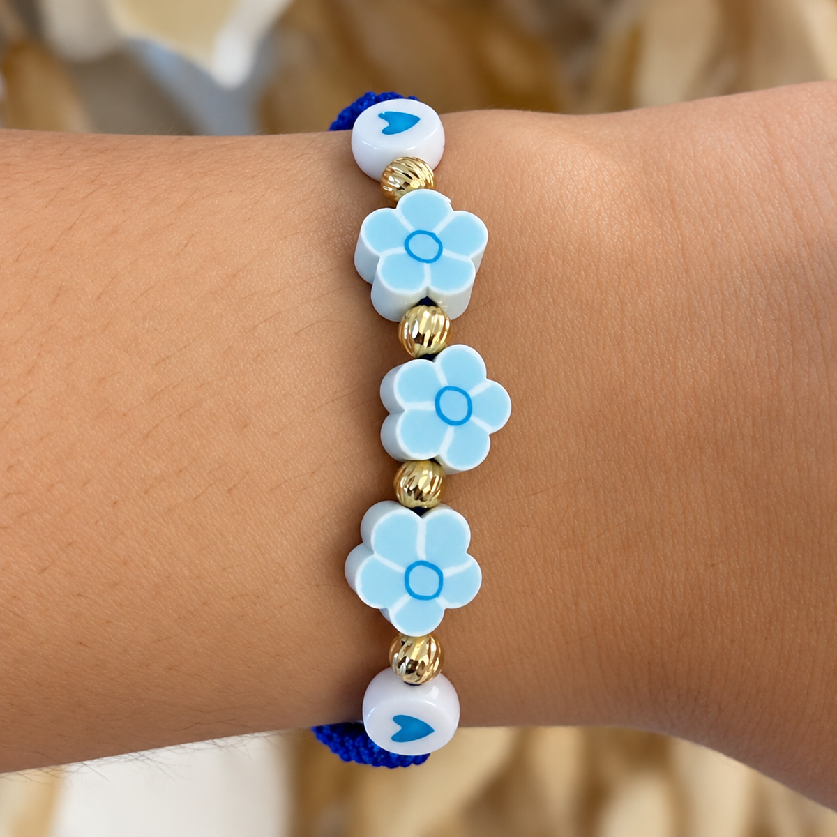 Pulsera de Margarita Azul y Corazones