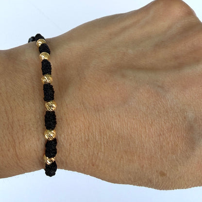 7/PULSERA NUDO CON CUENTAS DE ORO