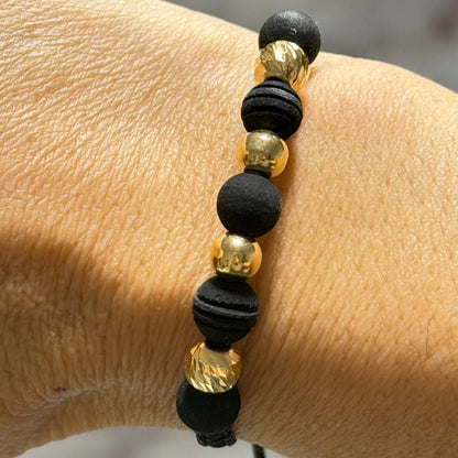 Bracelet with gold beads