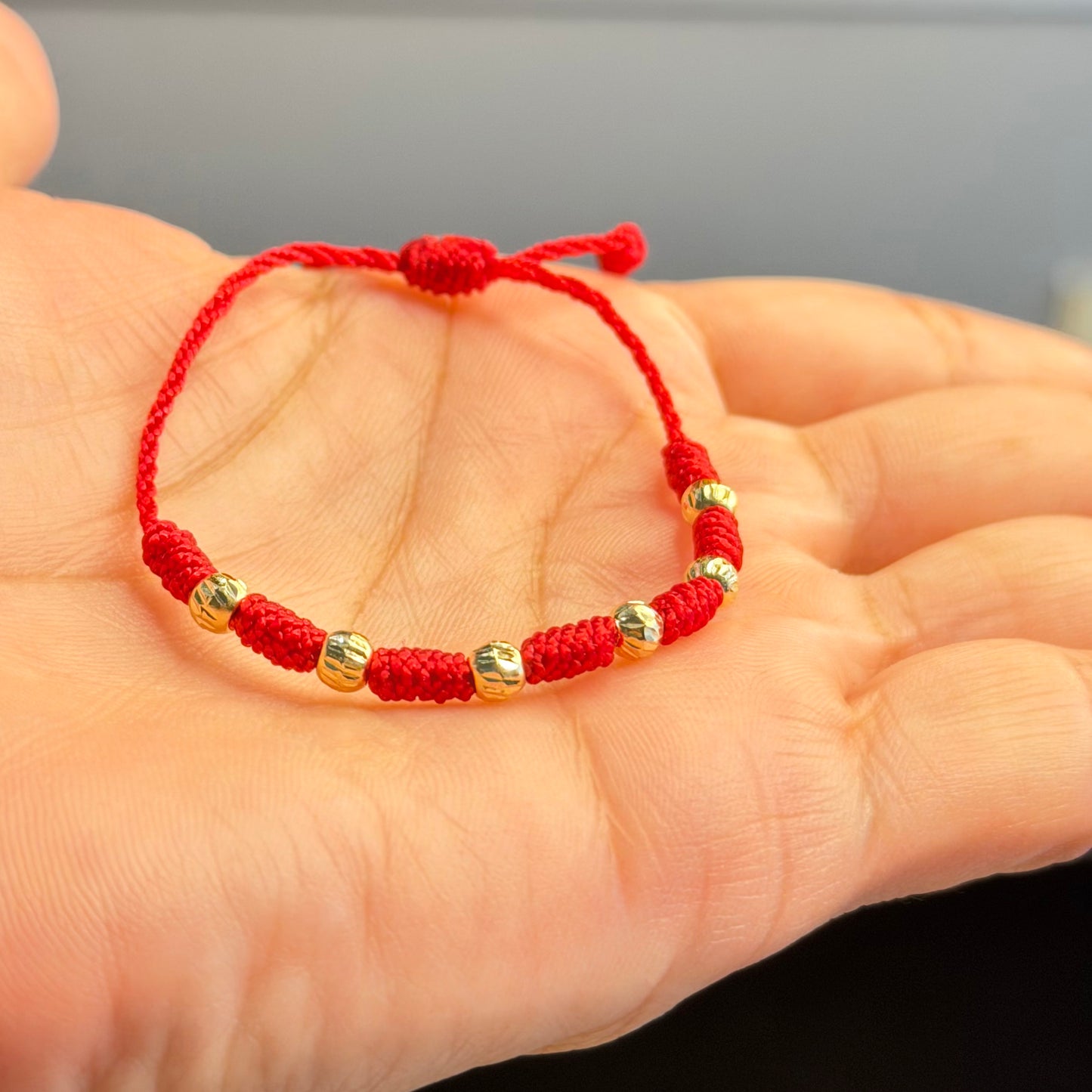 PULSERA DE BEBÉ DE 7 NUDOS/ORO DE 18K