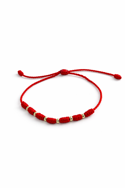 7/PULSERA NUDO CON CUENTAS DE ORO