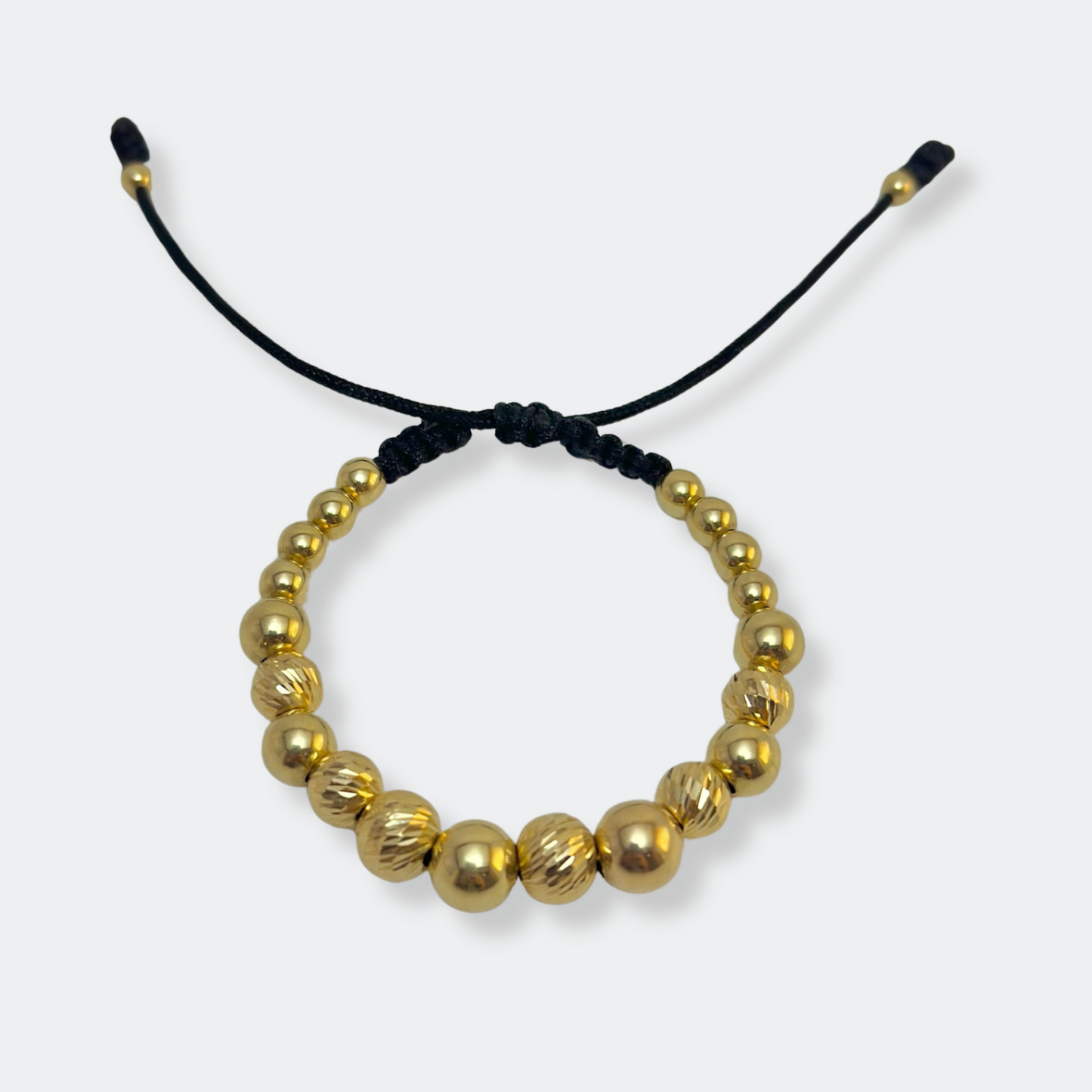 GOLD BRACELET WITH SMOOTH AND DIAMOND-CUT BEADS