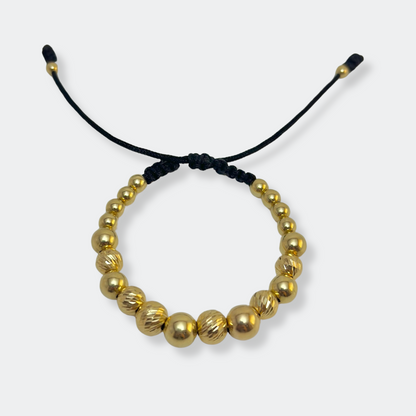GOLD BRACELET WITH SMOOTH AND DIAMOND-CUT BEADS