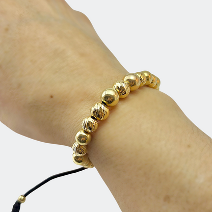 GOLD BRACELET WITH SMOOTH AND DIAMOND-CUT BEADS