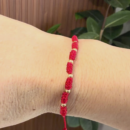 7/PULSERA NUDO CON CUENTAS DE ORO