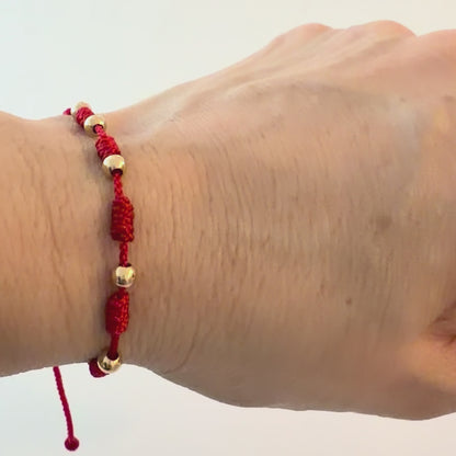 7/PULSERA NUDO CON CUENTAS DE ORO